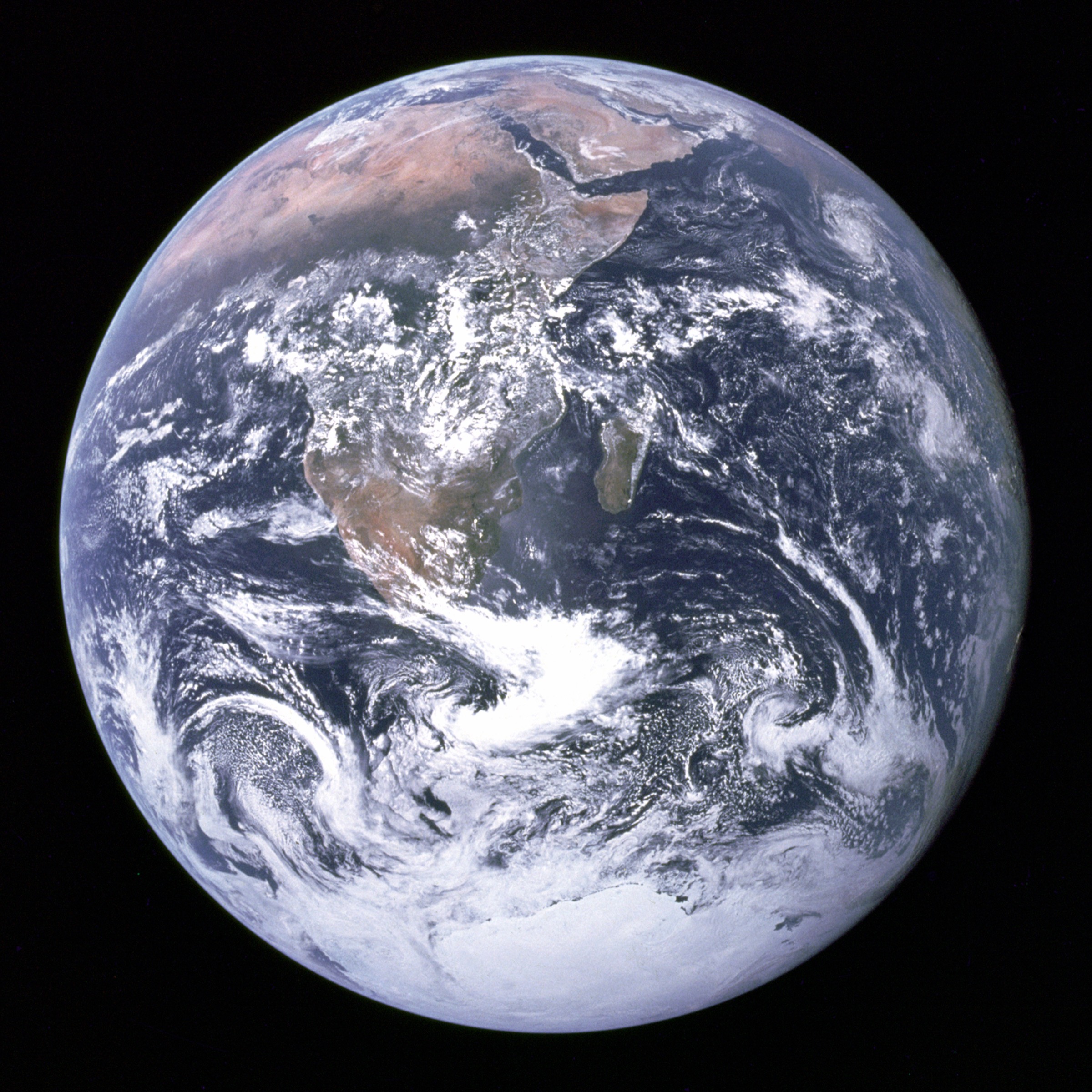The full disk of Earth photographed from Apollo 17 on December 7, 1972, showing the African continent, the Arabian Peninsula, and Antarctica under a clear atmosphere — the only fully-illuminated Earth photograph taken by a human crew