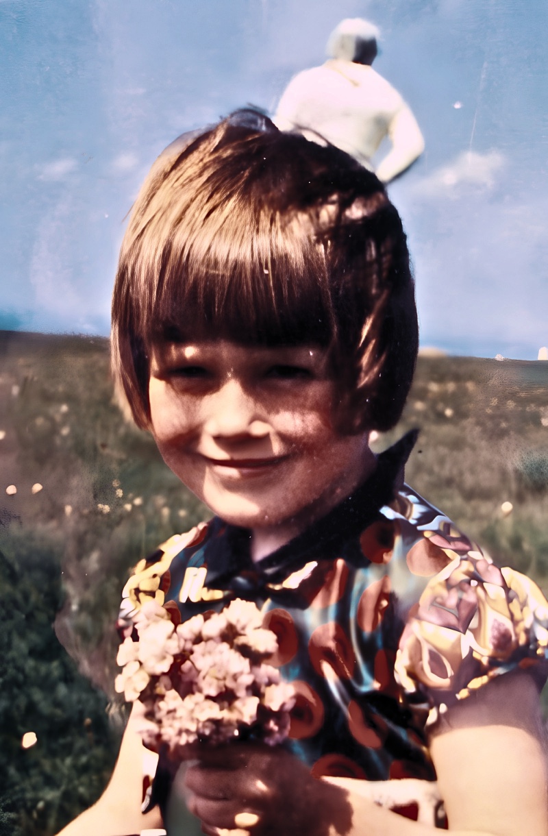 The 1964 Solway Firth photograph by Jim Templeton: his daughter Elizabeth stands on a marsh, with a silver-suited figure-like form behind her against the sky.