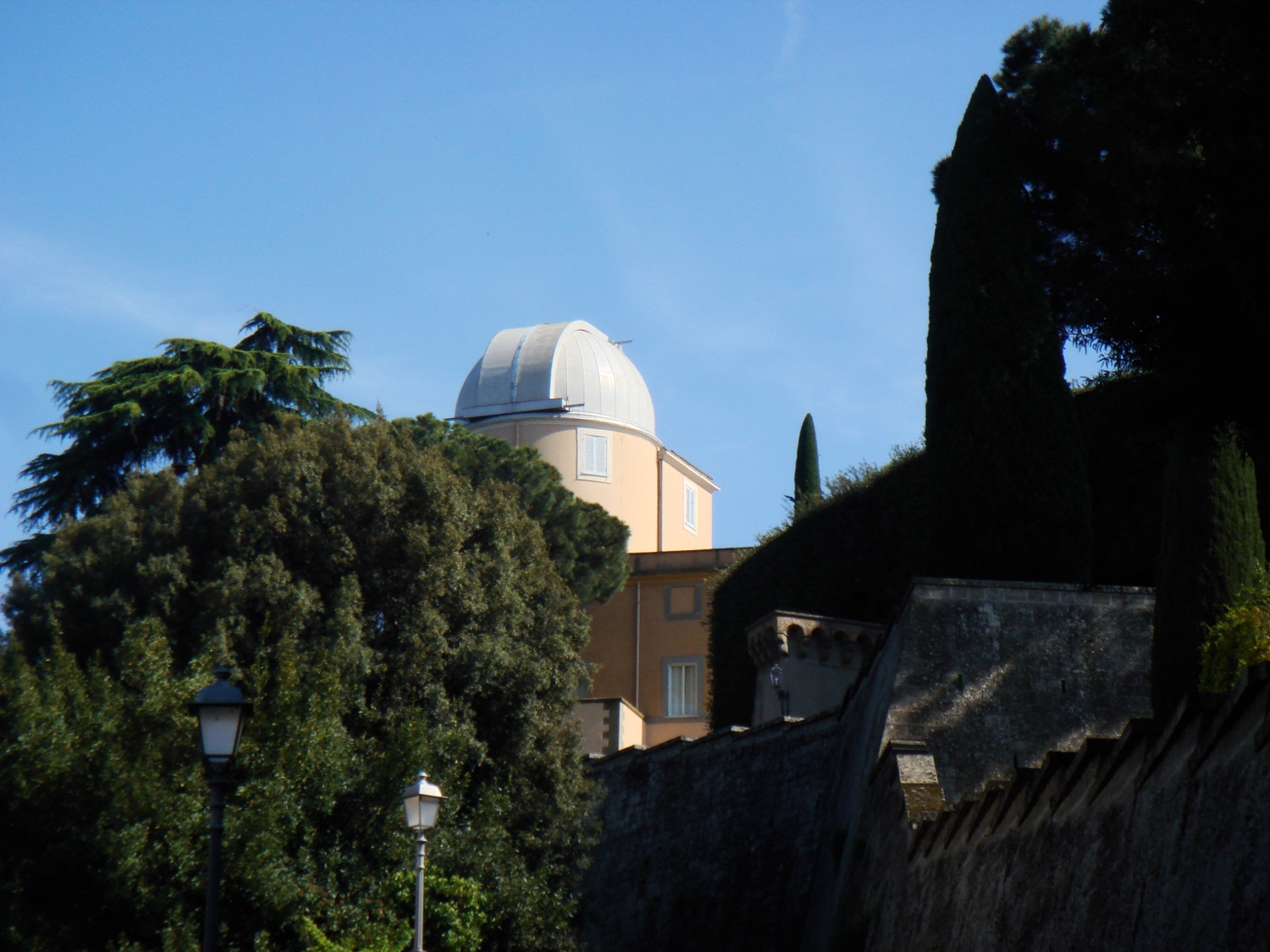 The white observatory dome of the Specola Vaticana rising above the Apostolic Palace at Castel Gandolfo.